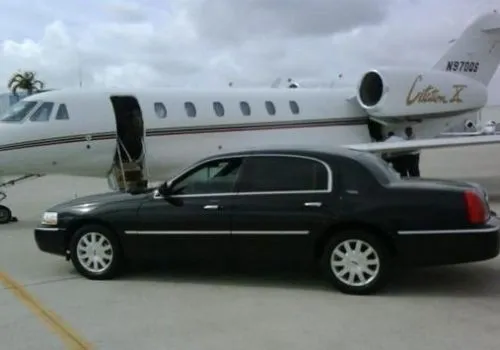 Lincoln Town car with jet plane